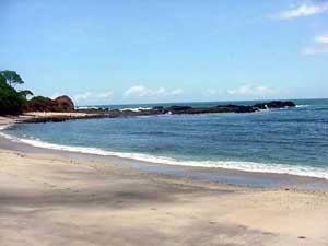 Foot prints on white sand beach